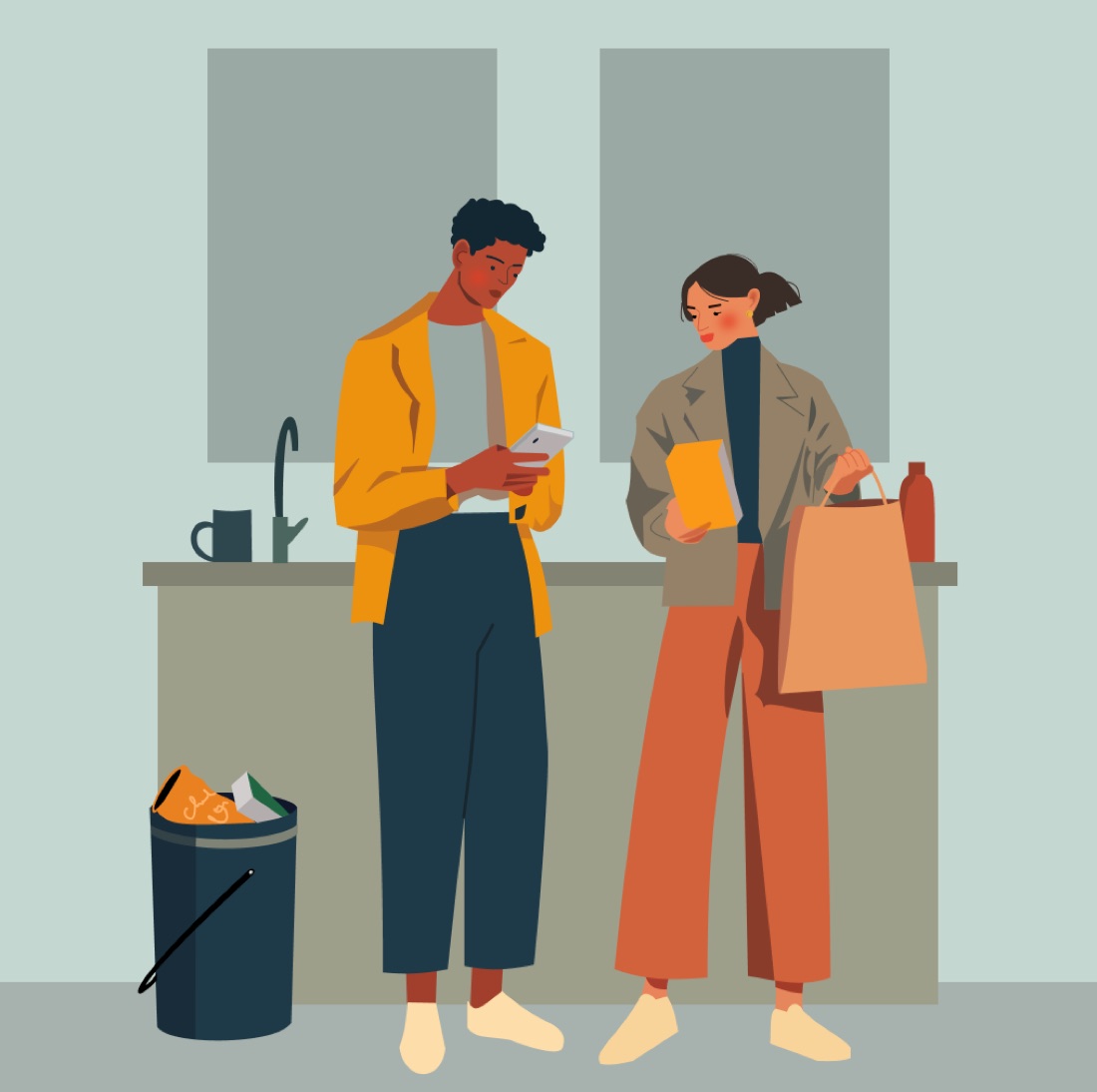 Deux parents consultent ensemble un téléphone dans leur cuisine